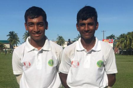 Marvin Prashad (left) and Nigel Deodat (Right) pose for a photo after guiding the National Under - 17s pass Essequibo 
