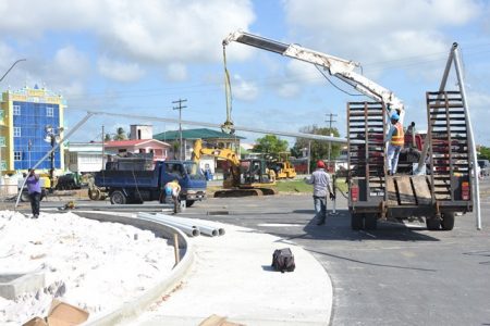 The installation of light poles ongoing. (DPI Photo)