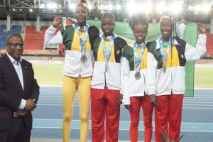 Chantoba Bright (extreme right) who helped the Girls U-20 4x400 relay team to a silver medal, will be back at the CARIFTA Games next year in the Cayman Islands for redemption in the triple jump. 
