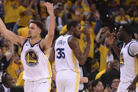 Klay Thompson, Kevin Durant and Draymond Greene of the Golden State Warriors celebrate their advance into the Western Conference semi-finals.