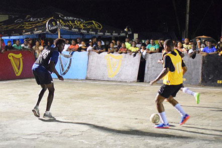 Flashback-Jermain Samuels (yellow) of Silver Bullets trying to initiate an attacking foray while being watched closely by Mark McLean (left) of Wisroc during their clash at the Silvercity Hard-court in the Guinness ‘Greatest of the Streets’ Linden edition