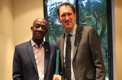 Prime Minister Keith Rowley (left) with CEO of Cricket Australia, James Sutherland, during their meeting. 