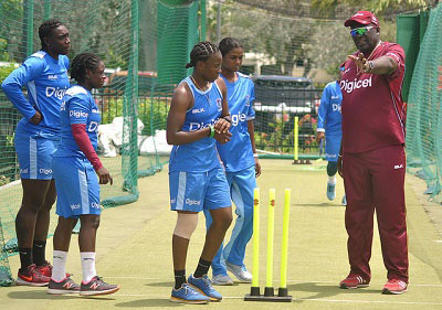 Coach Roddy Estwick takes members of the Windies Women bowling attack through their paces in the nets. (Photo courtesy CWI Media)