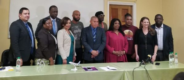 (From left, rear) Carl Stuart, GM, Caribbean Airlines; Saiku Andrews: Natural Black; Blaze Antonio; Department of Culture, Youth and Sport Music Development Officer  Andrew Tyndall. Front: Kevin Prashad, Airport representative, Caribbean Airlines; Director of Culture Tamika Boatswain; Senior Marketing Manager of Caribbean Airlines Alicia Cabrera; Minister of Social Cohesion Dr George Norton; Michelle ‘Big Red’ King and Kimberly Brasington, ExxonMobil representative. 