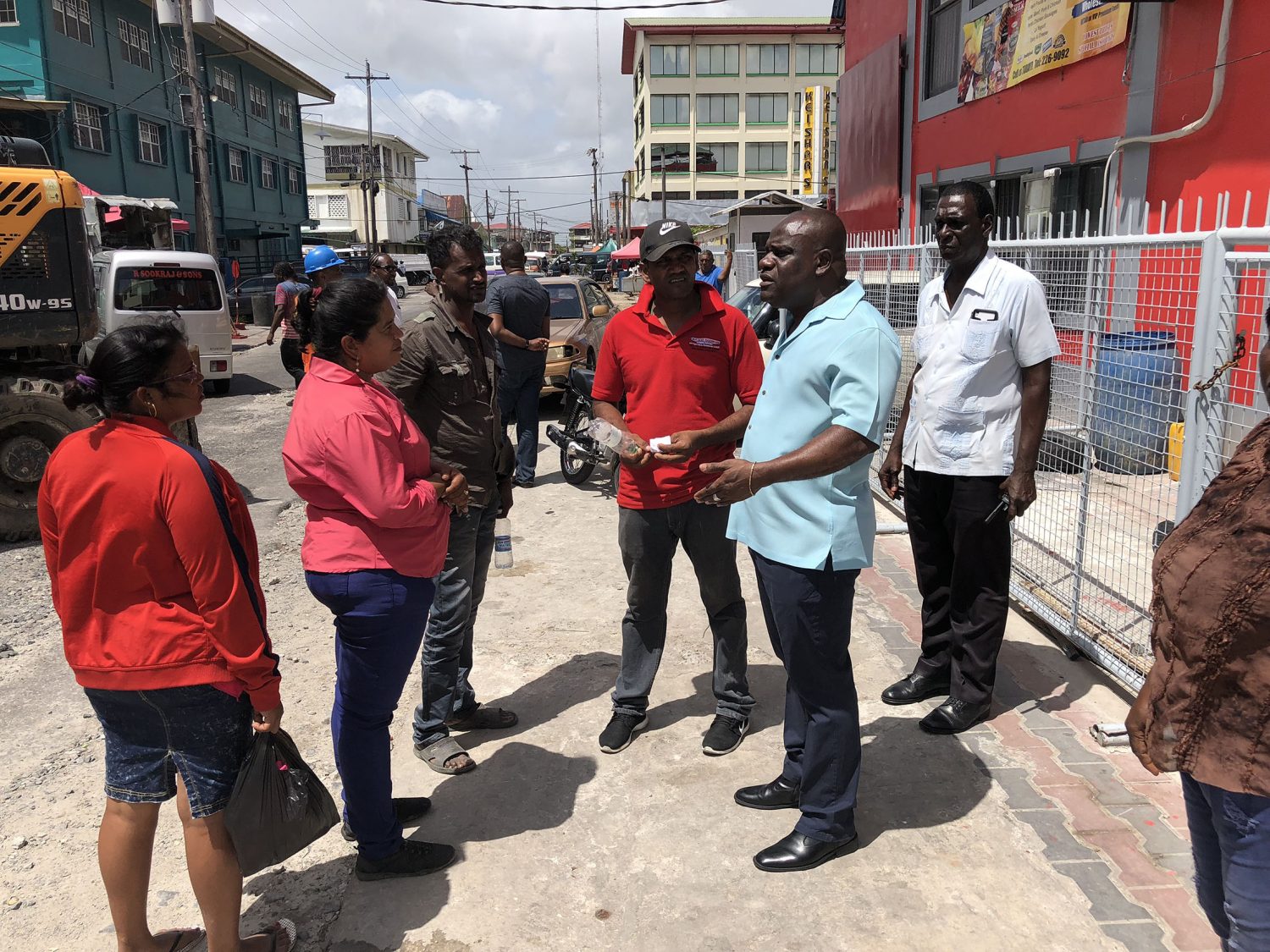 Some of the vendors from Bourda talking to Town Clerk Royston King (second from right) yesterday on Alexander Street.