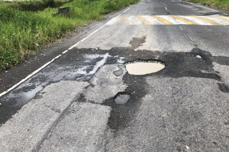 One of the potholes on the northern section of the Parfaite Harmonie Access Road