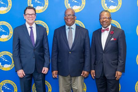 From left are CDB President Dr. Warren Smith, Minister of Finance Winston Jordan and UG Vice-Chancellor Dr. Ivelaw Griffith. (Ministry of Finance photo) 