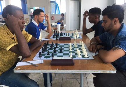 The participants of the Clash of Champions chess tournament, which is ongoing, will have their games measured in accordance with international standards. Through their performances they can either increase or decrease their coveted FIDE ratings. Above: Glenford Corlette (left) opposes Saeed Ali, a previous national junior champion, last Sunday at the Aquatic Centre. The tournament ends today.