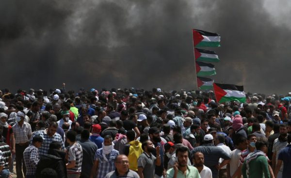 Palestinian demonstrators gather during a protest against U.S. embassy move to Jerusalem and ahead of the 70th anniversary of Nakba, at the Israel-Gaza border in the southern Gaza Strip May 14, 2018. REUTERS/Ibraheem Abu Mustafa