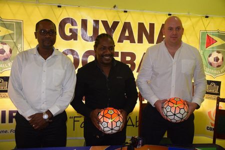President of the GFF Wayne Forde (left) alongside Director of Guyana Carnival Kerwin Bollers (centre) following the partnership between the two entities for the impending (CONCACAF) Caribbean Women’s Qualifiers. Also in the photo is GFF Technical Director Ian Greenwood.