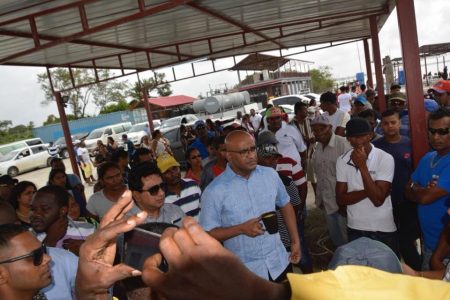 Opposition Leader Bharrat Jagdeo (centre in foreground) meeting with affected residents in Suriname.
