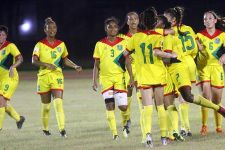 The Lady Jaguars Team celebrating their second equalizing goal against Bermuda scored by Cameo Hazlewood in their opening group-E clash in the CONCACAF Women’s Qualifiers at the National Track and Field Centre, Leonora last night. (Orlando Charles photo)
