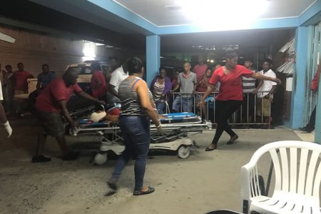  An injured person from the Kuru Kururu Public Road accident being wheeled into the GPHC accident and emergency unit. 
