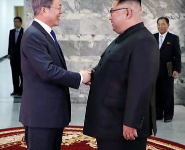 South Korean President Moon Jae-in shakes hands with North Korean leader Kim Jong Un during their summit at the truce village of Panmunjom, North Korea, in this handout picture provided by the Presidential Blue House on May 26, 2018. The Presidential Blue House /Handout via REUTERS