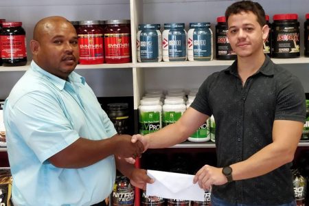 Representative of Fitness Express (47 Sheriff Street, Campbellville), Darren McDonald recently presented a cheque to Colin Austin, Treasurer of the Guyana Amateur Powerlifting Federation (GAPF),  to be the main sponsor of this year’s Claude Charles Memorial Intermediate and Masters Powerlifting Championships.