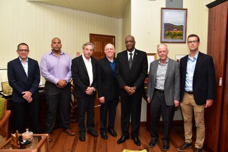 From left are Brud Drachman, Executive Vice President, PriceSmart Incorporated; Andron Alphonso, the local contact;  Leon Janks, Board Member, PriceSmart; Minister of State,  Joseph Harmon;  Robert Price, Founder and Chairman of the Board of Directors and  David Price, President of PriceSmart Incorporated during the meeting. (Ministry of the Presidency photo)