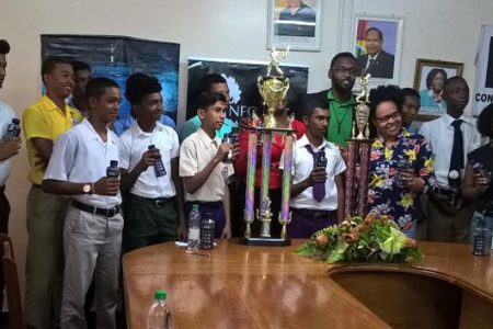 GCB TDO Colin Stuart, Director of Sport Christopher Jones, REO Pauline Lucas, Banks DIH’s Clive Pellew, stakeholders, sponsors and students pose with the prize for the inaugural RDC/DEVCON/Lloyd Britton/REO Inter Secondary School Cricket Competition.
