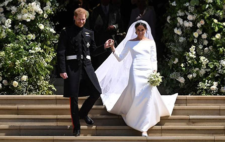 Britain's Prince Harry, Duke of Sussex and Meghan, Duchess of Sussex exit St George's Chapel in Windsor Castle after their royal wedding ceremony, in Windsor, Britain, May 19, 2018.  NEIL HALL/Pool via Reuters