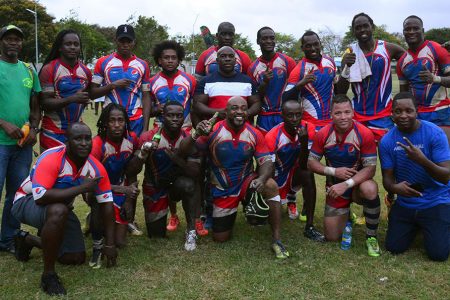 WE ARE THE CHAMPIONS! The Pepsi Hornets earned a 12-10 victory over the Caribs at the National Park on Sunday in the Carnival Sevens Tournament. (Orlando Charles photo)