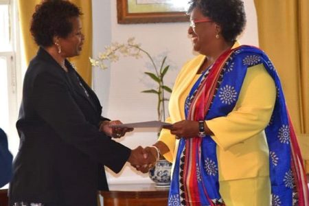 Prime Minister Mia Mottley (right) receiving the instrument of office from Governor General Dame Sandra Mason. (TeleSUR photo)
