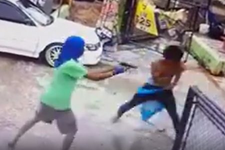 A screenshot from the video showing the criminals shooting.
