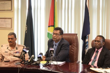 Minister of Public Security, Khemraj Ramjattan flanked by Commissioner of Police (ag), David Ramnarine (left) and Crime Chief, Paul Williams. (Department of Public Information photo)
