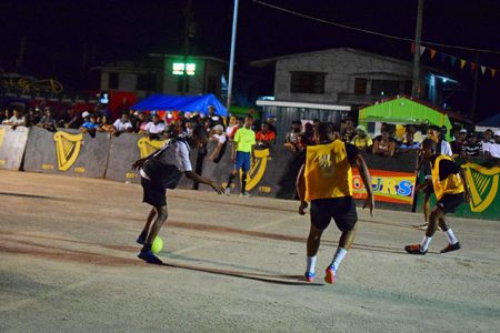 Flashback-Scenes from the semi-final round in the Guinness ‘Greatest of the Streets’ Linden championship between Silver Bullets (yellow) and High Rollers at the Mackenzie Bus Park Tarmac.