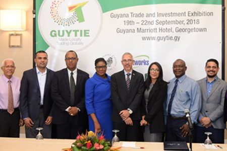 Business Minister Dominic Gaskin (fifth from right) with event sponsors at the launch of the Guyana Trade and Investment Exhibition. (DPI photo)