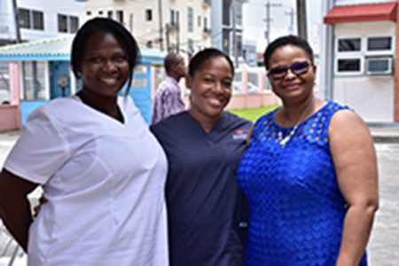 Minister of Public Health, Volda Lawrence (right) posing with some of the nurses (DPI photo)