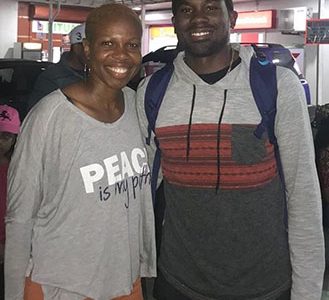 Aliann Pompey, the 2002 Commonwealth Games 400m gold medallist, with 2018 Commonwealth Games triple-jump gold medallist, Troy Doris upon his arrival at the Cheddi Jagan International Airport on Wednesday night.