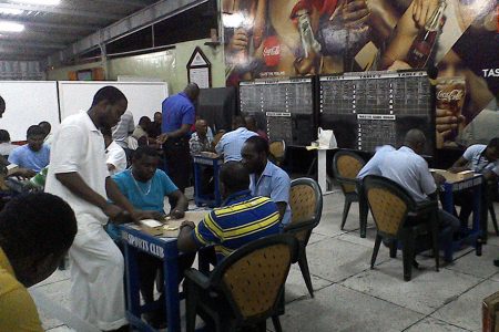A scene from the Power Generation, Water Plant and Trisco clash in the Banks DIH Limited ‘President’s Cup’ Inter-Department Domino Championship, at the Thirst Park Sports Club