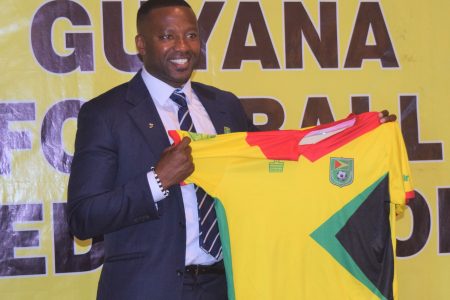   Newly appointed Golden Jaguars Head-Coach Michael Joseph, displaying the symbolic Golden Jaguars Jersey following his presentation to the media and public yesterday at the SleepIn Hotel and Casino 