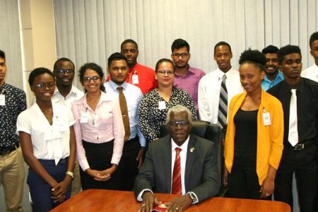 Director General, Lt. Col. (Ret’d) Egbert Field (seated), flanked by candidates for the Air Traffic Control Assistants training. (GCAA photo)
