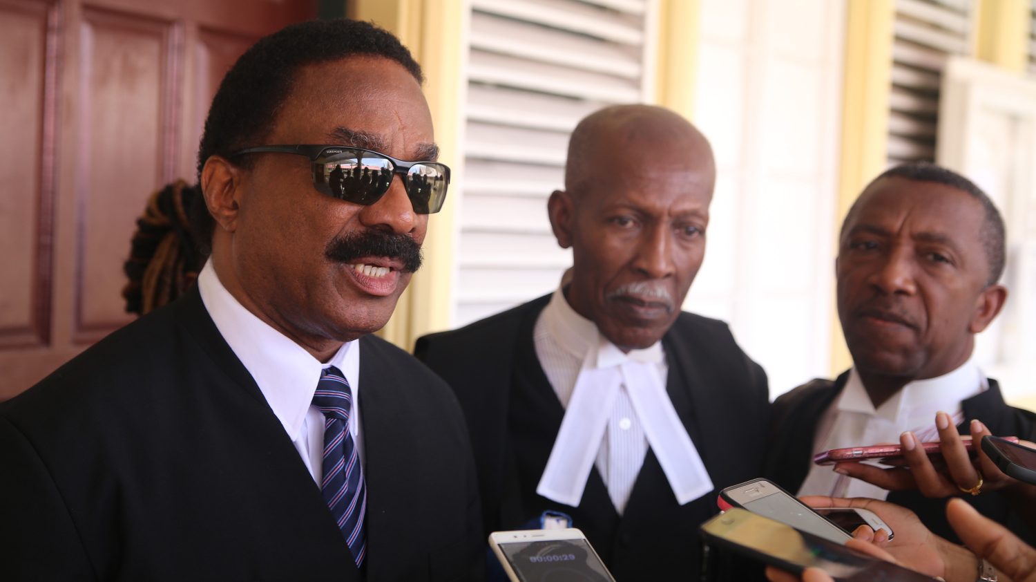 Attorney General Basil Williams (at left) along with Queen’s Counsel Hal Gollop (centre) and Queen’s Counsel Ralph Thorne, speaking with  reporters after the judgment. 
