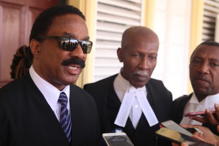 Attorney General Basil Williams (at left) along with Queen’s Counsel Hal Gollop (centre) and Queen’s Counsel Ralph Thorne, speaking with  reporters after the judgment.
