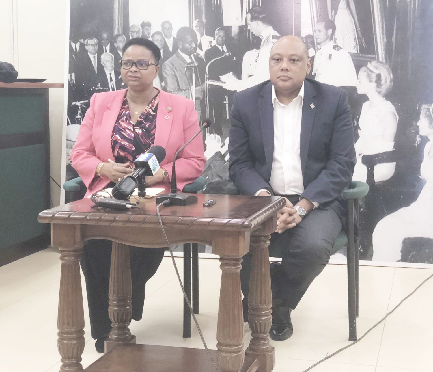 Minister of Public Health Volda Lawrence and Minister of Natural Resources Raphael Trotman at the press conference yesterday afternoon. 