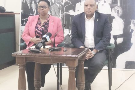 Minister of Public Health Volda Lawrence and Minister of Natural Resources Raphael Trotman at the press conference yesterday afternoon. 