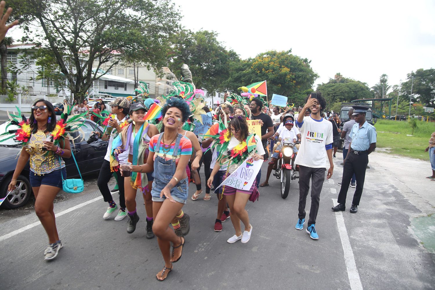 Activist Akola Thompson leads the hundreds that made up the procession for Guyana’s first Pride Parade as it moved off from Parade Ground in Georgetown. See story on page 3. (Terrence Thompson photo)