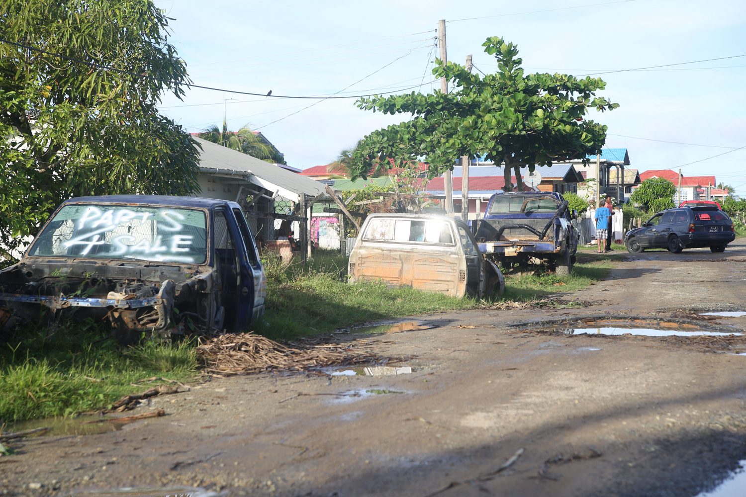Some of the vehicles along a potholed road in Cornelia Ida (Terrence Thompson photo)
