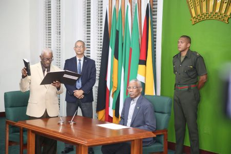 Retired Judge James Patterson taking the oath of office before President David Granger last October. (Stabroek News file photo)