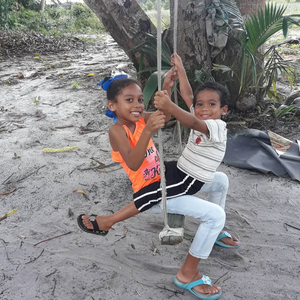 Cloyde Carryl’s grandchildren, Chavela and Chavez Persaud on a swing