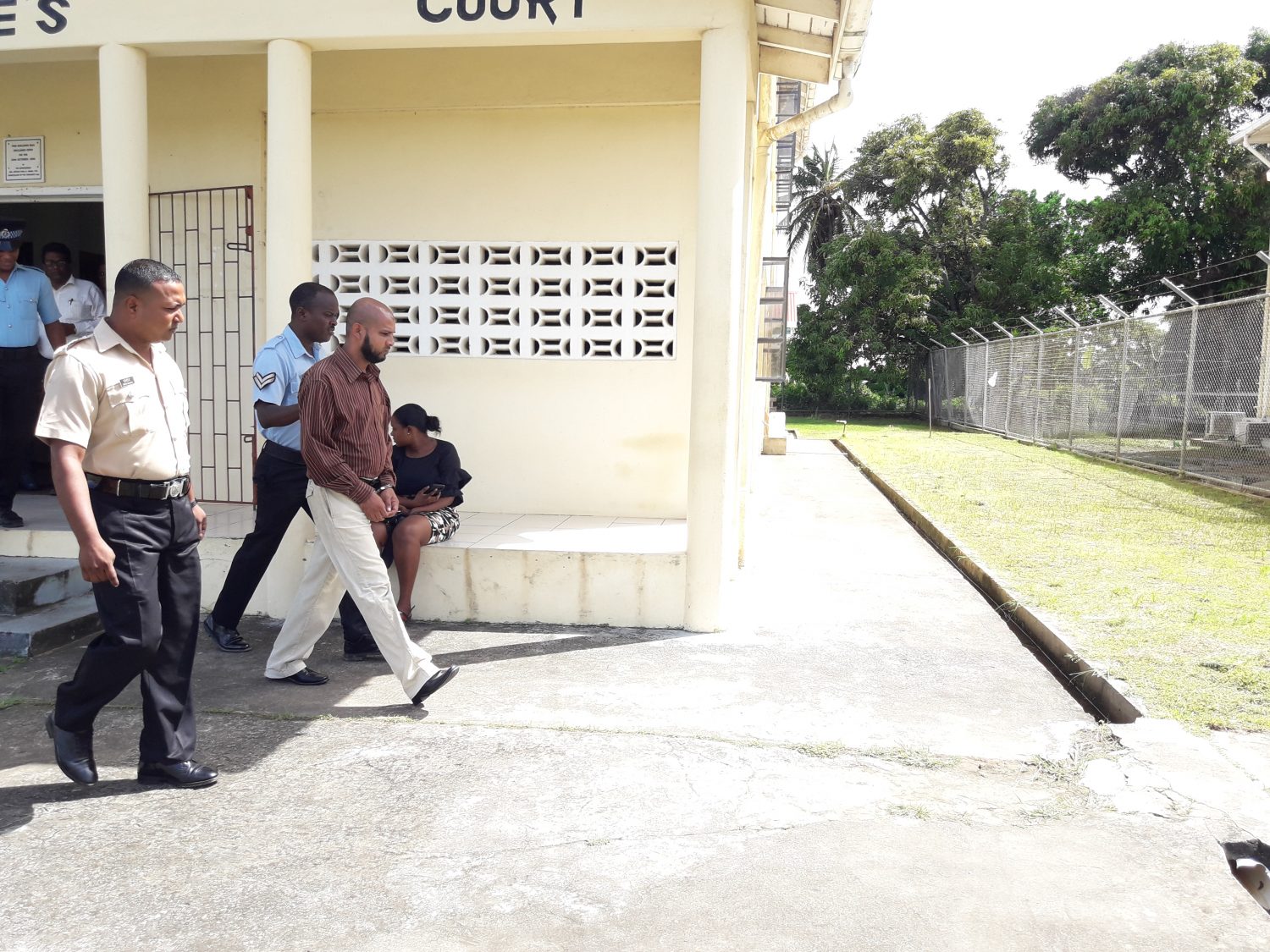 Abel Seetaram (with handcuffs) at court.