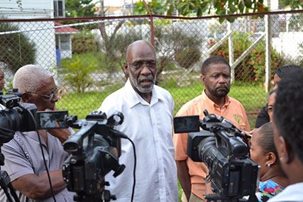 GECOM Commissioner, Vincent Alexander (centre) updating the media on the statutory meeting. (DPI photo)