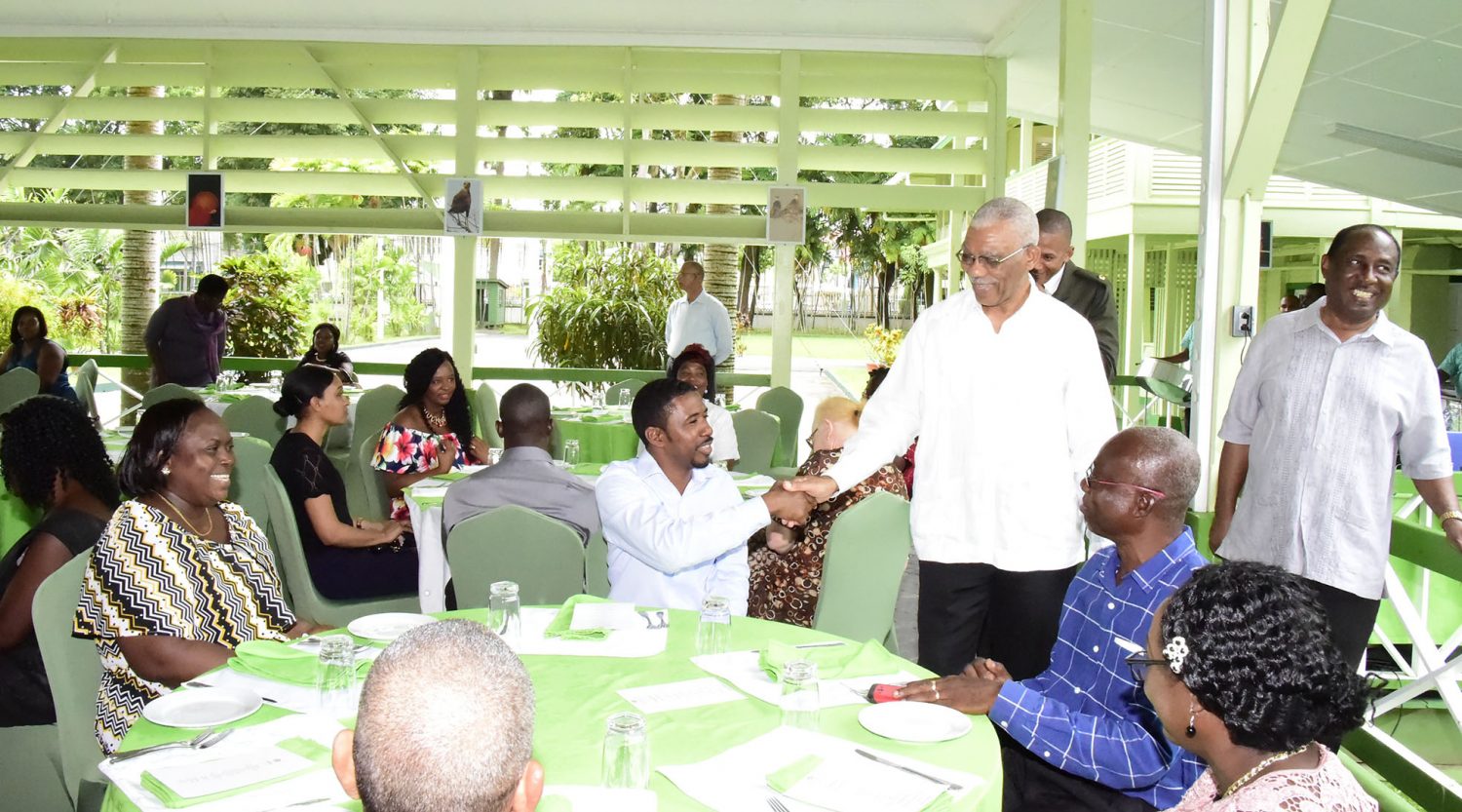 President David Granger (standing second from right) greeting a guest at the Baridi Benab. Standing at right is GPSU President, Patrick Yarde. (Ministry of the Presidency photo)
