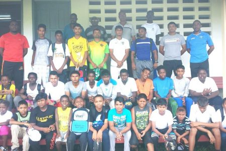  Top Awardees of the Camp posed with Coaches and Officials of the Upper Corentyne Cricket Association”.
