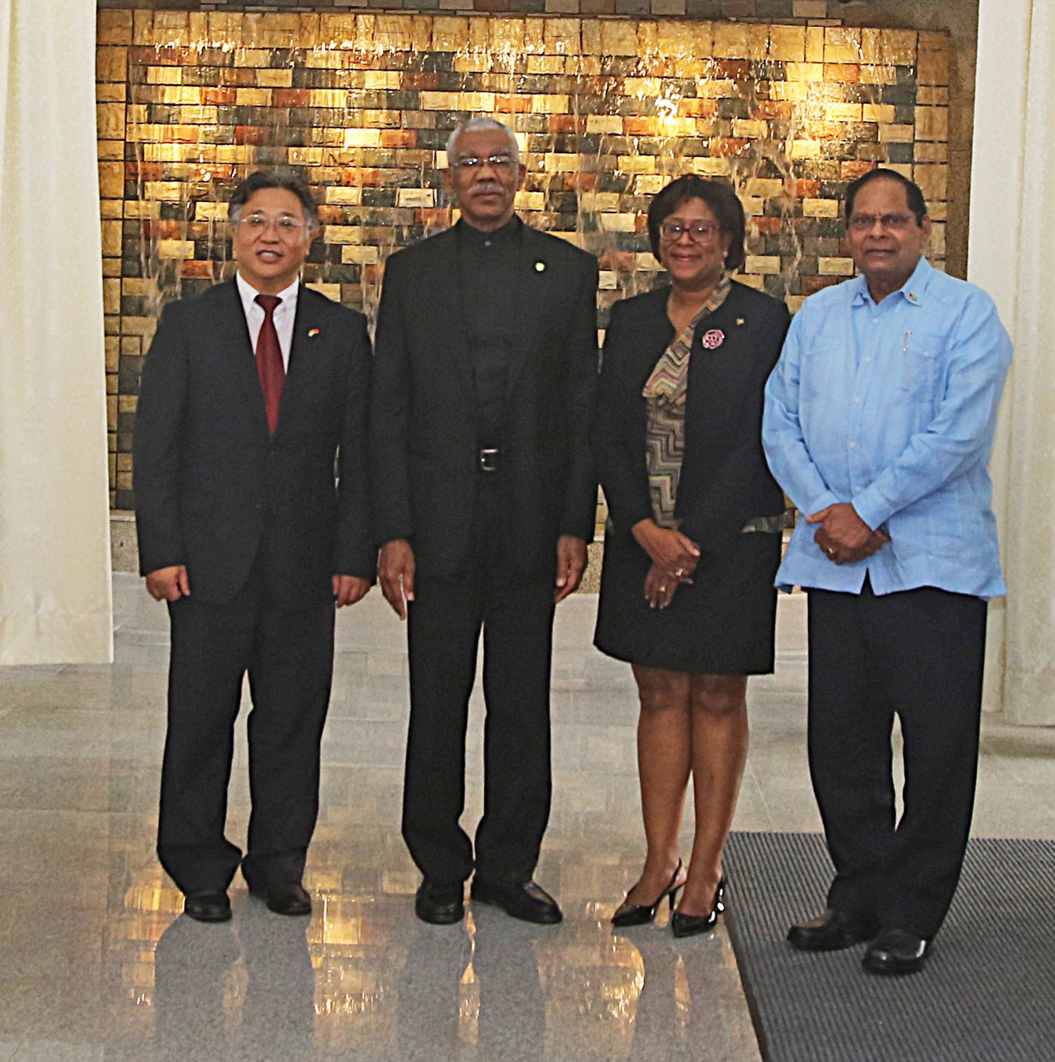 From left in background Ambassador of the People’s Republic of China Cui Jianchun stands with President David Granger, Minister of Public Telecommunications Catherine Hughes and Prime Minister Moses Nagamootoo, following the recommissioning of the Arthur Chung Convention Centre. (Photo by Terrence Thompson)