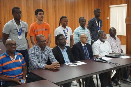 The top brass of the Guyana Olympic Association (GOA), other officials and representatives that competed at the just concluded South American Games in Bolivia pose for a photo opportunity yesterday at the GOA’s headquarters in Liliendaal. 