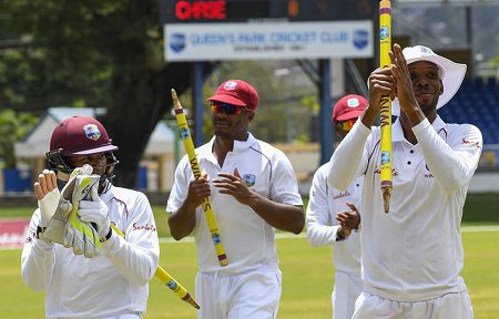 (From right to left) All-rounder Roston Chase, fast bowler Shannon Gabriel and wicketkeeper Shane Dowrich celebrate West Indies’ win in the opening Test on Sunday. (Photo courtesy CWI Media) 