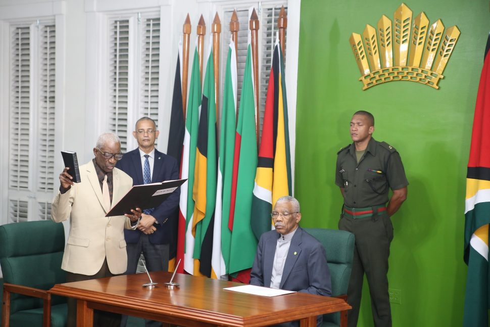 Justice (Rtd) James Patterson (left) taking the oath of office before President David Granger.