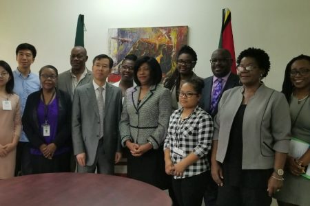 Representatives of the University of Guyana, the Embassy of the People’s Republic of China and University students at the signing of the MoU between the two bodies yesterday. From left are: Qiuyl Wang, Secretary to the Ambassador at the Chinese Embassy; Cao Fang, Chinese Director of the Confucius Institute; Claudette Austin, Dean of the Faculty of Education and Humanities; Al Creighton, Director of Language and Culture Studies; Chen Xilai, Deputy Chief of Mission of the Chinese Embassy; University of Guyana Student; Dr Barbara Reynolds, Deputy Vice-Chancellor, Planning and International Engagement, UG; Raulene Kendall, International Engagement Officer; University  of Guyana Student; Professor Leyland Lucas, Dean of the School of Entrepreneurship and Business Innovation; Paulette Paul, PRO, UG; and Nikki Cole, Senior International Engagement Officer.
